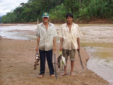 photo: Two Tsimane men with the day's catch